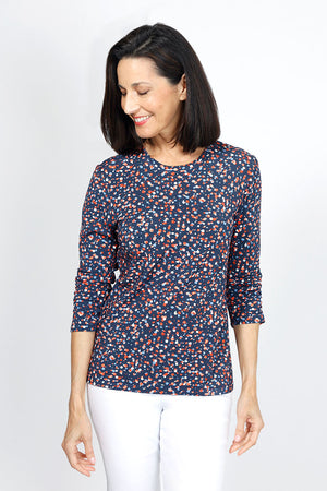 Lolo Luxe Becki Odd Dot Top in Navy with multi color abstract miniature dots.  Crew neck top with 3/4 sleeve with ruched hem.  Relaxed fit._34940505522376