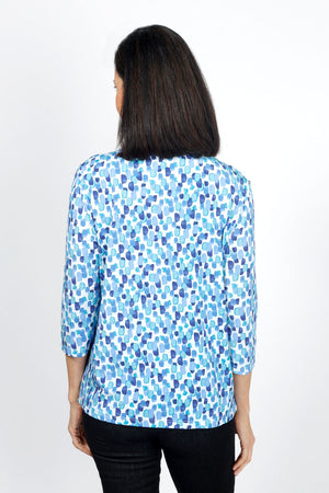 Lolo Luxe Sherri Candyland V Neck top. Shades of blue overlapping brush print on white. V neck 3/4 sleeve top. High low hem. Relaxed fit._34940545368264