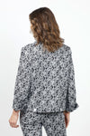 Holland Ave Daisy Jean Jacket in Black with white daisy print. Pointed collar button down jacket with jean jacket detail. Front flap pockets. Yoke in front & back. Long sleeve with split cuff. Banded bottom with button tabs in back. White buttons. Relaxed fit._t_34980833722568