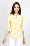 Lolo Luxe Trish Paper Dots Top in Yellow. Abstract gradient dots on a white background. Banded collar split v neck top with 3/4 sleeve with banded cuff. Curved hem. Relaxed fit._t_34940477374664