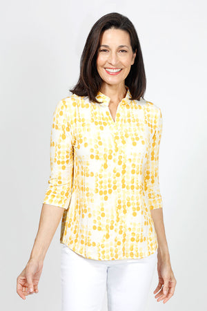Lolo Luxe Trish Paper Dots Top in Yellow. Abstract gradient dots on a white background. Banded collar split v neck top with 3/4 sleeve with banded cuff. Curved hem. Relaxed fit._34940477374664