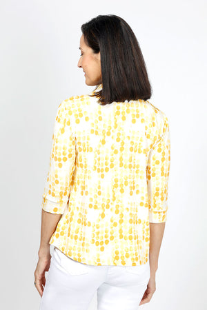 Lolo Luxe Trish Paper Dots Top in Yellow. Abstract gradient dots on a white background. Banded collar split v neck top with 3/4 sleeve with banded cuff. Curved hem. Relaxed fit._34940477407432