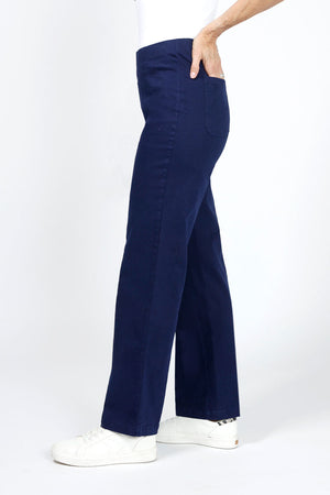 Holland Ave Diana Wide Leg Jean in Denim. Pull on pant with hidden elastic waistband and faux front fly. Smooth fit through stomach widens to hem. 30" inseam._34940573909192
