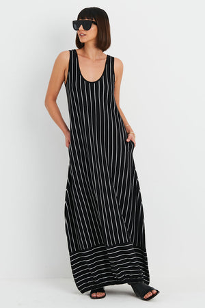 Planet Striped Lantern Dress in Black with narrow white stripes.  Scoop neck sleeveless dress with bubble skirt and cinched hem.  Insert of horizontal stripes at hem.  2 side seam pockets.  Oversized fit._34902908502216
