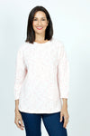 Ten Oh 8 Dolman Sweater with Slant Pocket in Coral. Pink textured flecks on a light background.  Crew neck 3/4 sleeve dolman knit.  Single angled patch pocket on left side.  Curved hem in front; straight in back. Relaxed fit._t_52912145465710