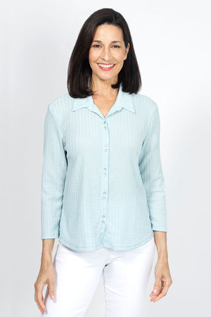 Top Ligne Snap Front Pucker shirt in Aqua. Pointed collar snap front top with pairs of snaps. Textured top. 3/4 sleeve. shirt tail hem. Relaxed fit._34977685635272