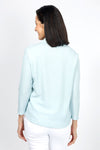 Top Ligne Snap Front Pucker shirt in Aqua. Pointed collar snap front top with pairs of snaps. Textured top. 3/4 sleeve. shirt tail hem. Relaxed fit._t_34977685864648