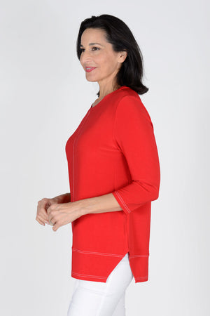 OURS Darla Front Seam Top in Red. Crew neck tunic length tub with 3/4 sleeve. White double top stitching detail down center front and back and at hem. Cut out side slits. Relaxed shape._34306755756232