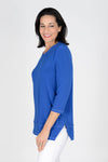 OURS Darla Front Seam Top in Royal blue. Crew neck tunic length tub with 3/4 sleeve. White double top stitching detail down center front and back and at hem. Cut out side slits. Relaxed shape._t_35491947610312
