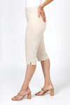 Holland Ave Julia Denim Pedal Pusher in Khaki. Pull on pant with elastic hidden waist and faux zipper pocket. Slim through leg. Side slits. 17" inseam._t_36030721065160
