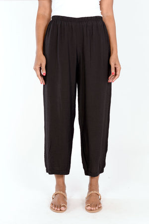 Organic Rags Crop Pant with Dart in Black.  Elastic waist lightweight crinkle pant with balloon leg and darts at hem to taper.  26" inseam._34247545323720