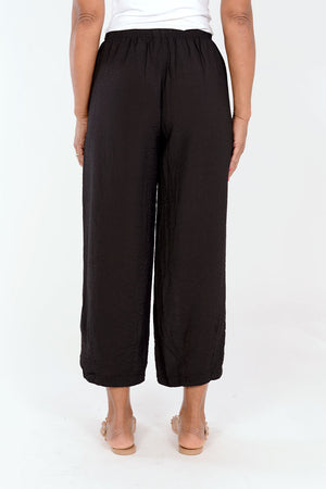 Organic Rags Crop Pant with Dart in Black. Elastic waist pull on pant with dart at hem. Draped leg. 11" leg opening. 26" inseam._34603462492360