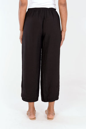 Organic Rags Crop Pant with Dart in Black. Elastic waist lightweight crinkle pant with balloon leg and darts at hem to taper. 26" inseam._34247545290952