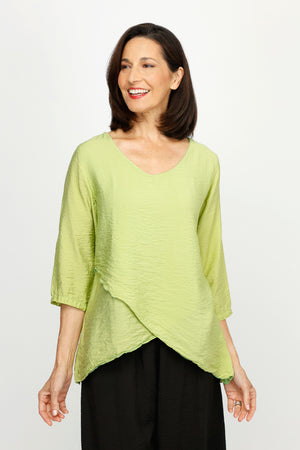 Organic Rags Double Layer Top in Verde.  V neck light crinkle top with 3/4 sleeve.  Overlapping criss-crossed panels create asymmetric hem.  Sewn edges at neck and hem.  Relaxed fit._60221079880046