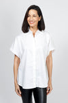 Planet Button Up Shirt in White. Pointed collar button down with hidden button placket. Short dolman sleeve. 3 functional buttons at side seams. Curved hem in front. One size fits many_t_34953303228616