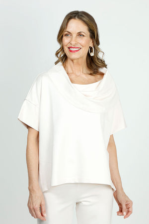 Planet Scuba Drape Neck Top in Vanilla. Drape cowl neck with short dolman sleeves. Scuba fabric. Side slits. Boxy shape. Oversized fit._36030539399368