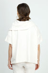 Planet Scuba Drape Neck Top in Vanilla. Drape cowl neck with short dolman sleeves. Scuba fabric. Side slits. Boxy shape. Oversized fit._t_36030539333832