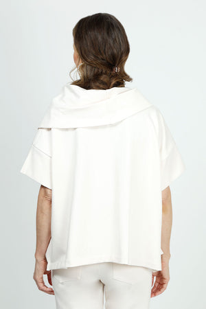 Planet Scuba Drape Neck Top in Vanilla. Drape cowl neck with short dolman sleeves. Scuba fabric. Side slits. Boxy shape. Oversized fit._36030539333832