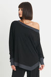 Planet Matte Jersey Boat Neck Top in Black with Obsidian gray trim at neckline, cuff and hem.  Boat neck with long sleeves and cinched cuff.  Asymmetric pointed hem in front.  Slightly curved hem in back.  Oversized fit.  One size fits many._t_34273174651080