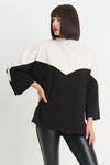 Planet Scuba Chevron Top in Black/Vanilla.  2 tone top with rolled funnel neck and dolman 3/4 sleeve.  Colors are separated top to bottom in a chevron pattern.  Oversized fit.  Swing shape.  One size fits most._t_34304457834696