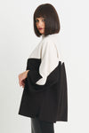 Planet Scuba Chevron Top in Black/Vanilla. 2 tone top with rolled funnel neck and dolman 3/4 sleeve. Colors are separated top to bottom in a chevron pattern. Oversized fit. Swing shape. One size fits most._t_34304457801928