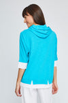Neon Buddha Dolman Top in Gulf blue. Crew neck dolman elbow sleeve top. Colorblock inserts at neck and hem. Front contour seams with contrast piping. Front inseam pockets with button detail. Attached hood with contrast drawstrings. Relaxed fit._t_35324927279304