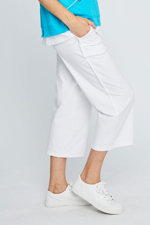 Neon Buddha Classic Wide Leg Capri in White. 2" waistband pull on pant with side slash pockets and wide legs. 11" leg opening. 23 1/2" inseam._35323586642120