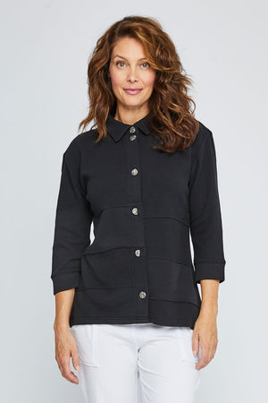 Neon Buddha Raw Seams Shirt in Black.  Pointed collar button down with metallic novelty buttons.  3/4 sleeve with button cuff.  High low hem.  Waffle weave with pieced front.  Relaxed fit._35323954364616