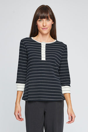 Neon Buddha Striped Henley in Black with narrow white stripes.  Waffle weave crew neck with 5 button placket.  3/4 sleeve with contrast cuff of narrow black stripes on white.  Neck trim and 5 button placket in white with narrow black stripes. Relaxed fit._35352652218568