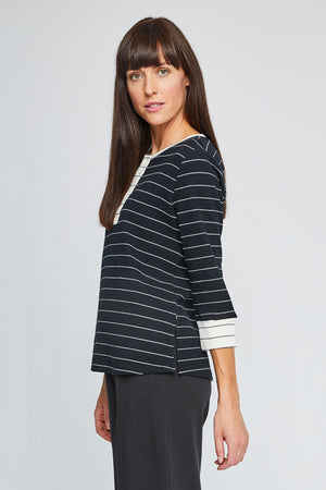 Neon Buddha Striped Henley in Black with narrow white stripes. Waffle weave crew neck with 5 button placket. 3/4 sleeve with contrast cuff of narrow black stripes on white. Neck trim and 5 button placket in white with narrow black stripes. Relaxed fit._35352652185800