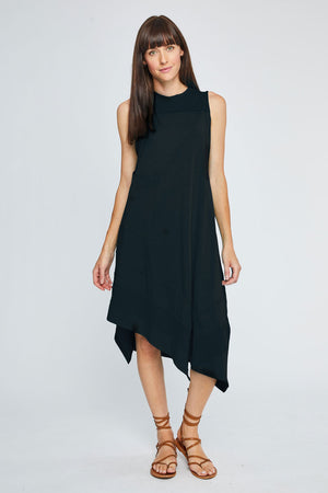 Neon Buddha Avalon Dress in Black.  Sleeveless crew neck dress with front yoke in slub cotton.  Asymmetric tiered, pieced hem with raw edges.  Single front patch pocket.  A line shape.  Relaxed fit._35352682954952
