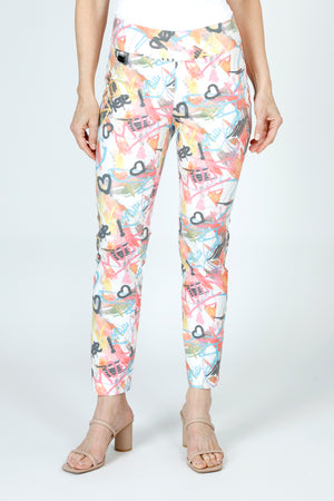 Lisette L Montreal Love Graffiti Ankle Pant in Multi. Multi colored graffiti print with heart motif.  3" waistband pull on pant with tummy control.  Snug through the stomach and hip and slim through leg.  28" inseam._59949950730606