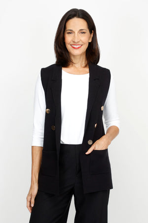 Metric Button Vest in Black.  Notched lapel open front vest with 3 gold tone buttons on the diagonal on each front side.  2 front patch pockets.  Classic fit._61255796523374