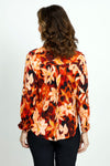 Cali Girls Floral Print Blouse in Red.  Abstract floral in shades of red orange and cream with touches of black.  Pointed collar button down.  Long sleeves with 1 button fold back cuff.  Back yoke.  Shirt tail hem.  Relaxed fit._t_52871633666414