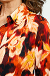 Cali Girls Floral Print Blouse in Red.  Abstract floral in shades of red orange and cream with touches of black.  Pointed collar button down.  Long sleeves with 1 button fold back cuff.  Back yoke.  Shirt tail hem.  Relaxed fit._t_52871633600878