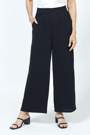 Top LIgne Relaxed Wide Leg Pant in Black.  Lightly textured fabric.  2" elastic waistband with 2 front slash pockets.  Wide draped leg.  12" wide at leg opening; 26" inseam._35194735296712