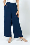 Top LIgne Relaxed Wide Leg Pant in Navy. Lightly textured fabric. 2" elastic waistband with 2 front slash pockets. Wide draped leg. 12" wide at leg opening; 26" inseam._t_35194735231176