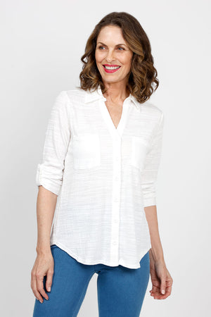 Top Ligne 2 Pocket Button Down Top in White. Textured fabric. Pointed collar with split v neck button down. 3/4 sleeve with button tab closure. 2 front chest patch pockets. Shirt tail hem. Relaxed fit._35439000158408