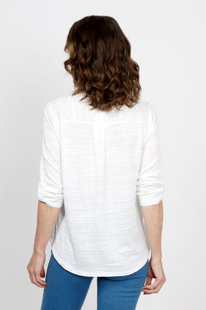 Top Ligne 2 Pocket Button Down Top in White. Textured fabric. Pointed collar with split v neck button down. 3/4 sleeve with button tab closure. 2 front chest patch pockets. Shirt tail hem. Relaxed fit._35438999961800