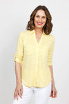 Top Ligne 2 Pocket Button Down Top in Lemon. Textured fabric. Pointed collar with split v neck button down. 3/4 sleeve with button tab closure. 2 front chest patch pockets. Shirt tail hem. Relaxed fit._t_35439000223944