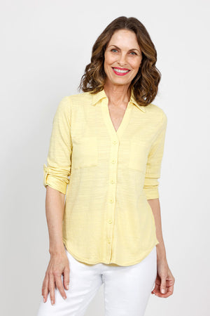 Top Ligne 2 Pocket Button Down Top in Lemon. Textured fabric. Pointed collar with split v neck button down. 3/4 sleeve with button tab closure. 2 front chest patch pockets. Shirt tail hem. Relaxed fit._35439000223944