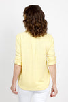 Top Ligne 2 Pocket Button Down Top in Lemon. Textured fabric. Pointed collar with split v neck button down. 3/4 sleeve with button tab closure. 2 front chest patch pockets. Shirt tail hem. Relaxed fit._t_35438999863496