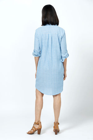 Organic Rags Washable Linen Striped Shirt Dress in Denim and white stripes. Pointed collar button down shirt dress with optional waist tie. 2 front flap pockets. 3/4 sleeve with button cuff and button tab. Back yoke. Curved hem. Relaxed fit._35181548339400