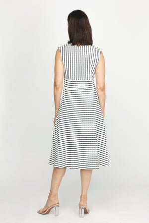 Top Ligne Pucker Stripe V Neck Dress in Black/White stripes.  Sleeveless. Surplice v neck with inset waistband.  Diagonal stripe bodice. Horizontal stripe skirt.  Fit and flare silhouette. Relaxed fit._60254666817902