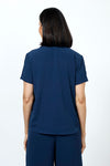 Top Ligne Collared Popover in Navy. Lightweight finely textured top. Pointed collar with open v placket. Short sleeves with sewn cuffs. Loose pleat in front. Curved hem. Relaxed fit._t_35201961459912