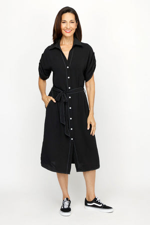 Top Ligne Airflow Contrast Stitch Shirt Dress in Black.  Pointed collar with notched v neck.  Button down shirt dress with self belt.  Short sleeves with button tab.  Contrast top stitching.  Relaxed fit._61184856228206