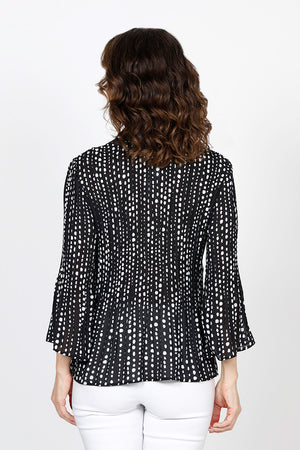 Cali Girls Tiny Dots Pleated Bell Sleeve Blouse in Black with tiny white dots print. Pointed collar v neck button down. Vertical pleating through body. Long pleated bell sleeves. Relaxed fit._35537565745352