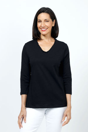 Top Ligne Ruffle Trim Tee in Black. Slub cotton v neck 3/4 sleeve tee with ruffle trim at neckline. Relaxed fit._35202202534088