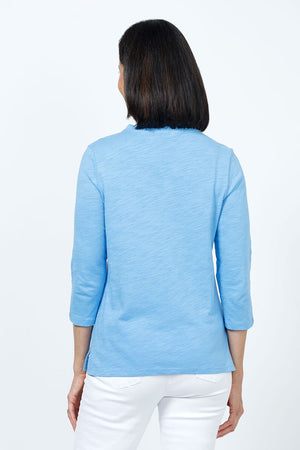 Top Ligne Ruffle Trim Tee in Capri blue. Slub cotton v neck 3/4 sleeve tee with ruffle trim at neckline. Relaxed fit._35202202140872