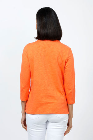 Top Ligne Ruffle Trim Tee in Mandarin. Slub cotton v neck 3/4 sleeve tee with ruffle trim at neckline. Relaxed fit._35202203287752
